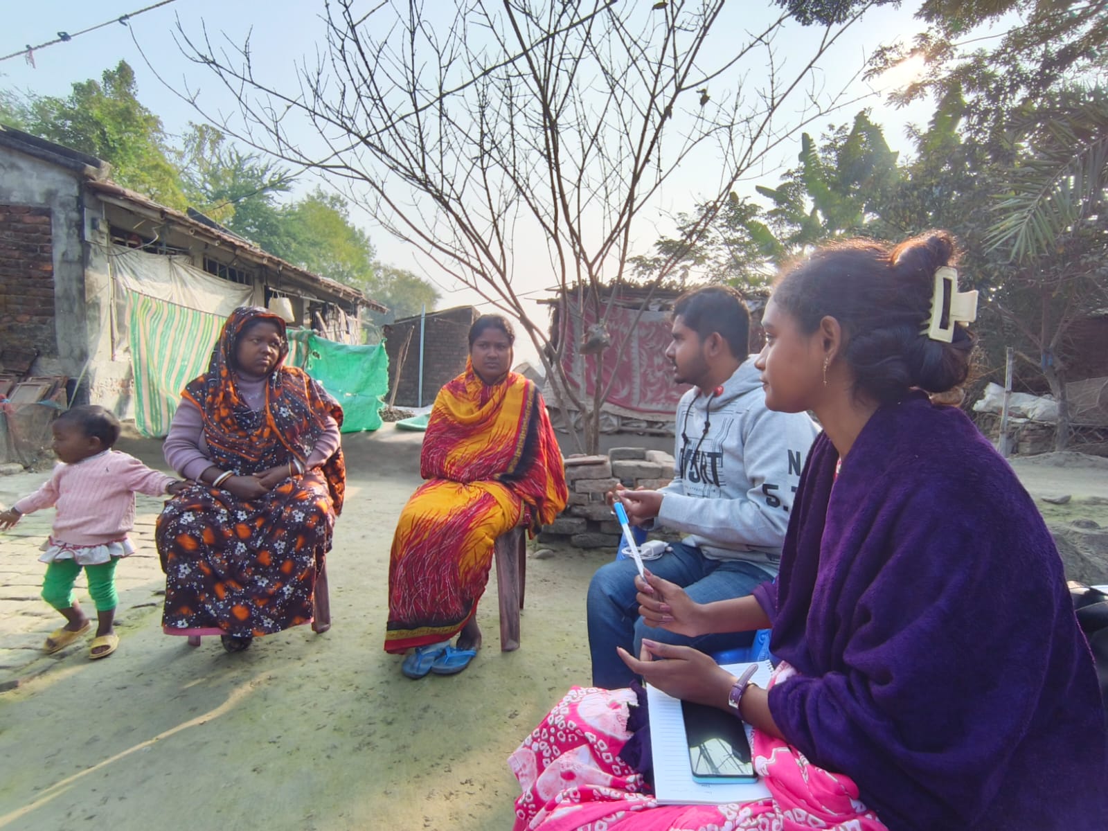 Community meeting discussing women's rights and empowerment representing the Lekhoni Project