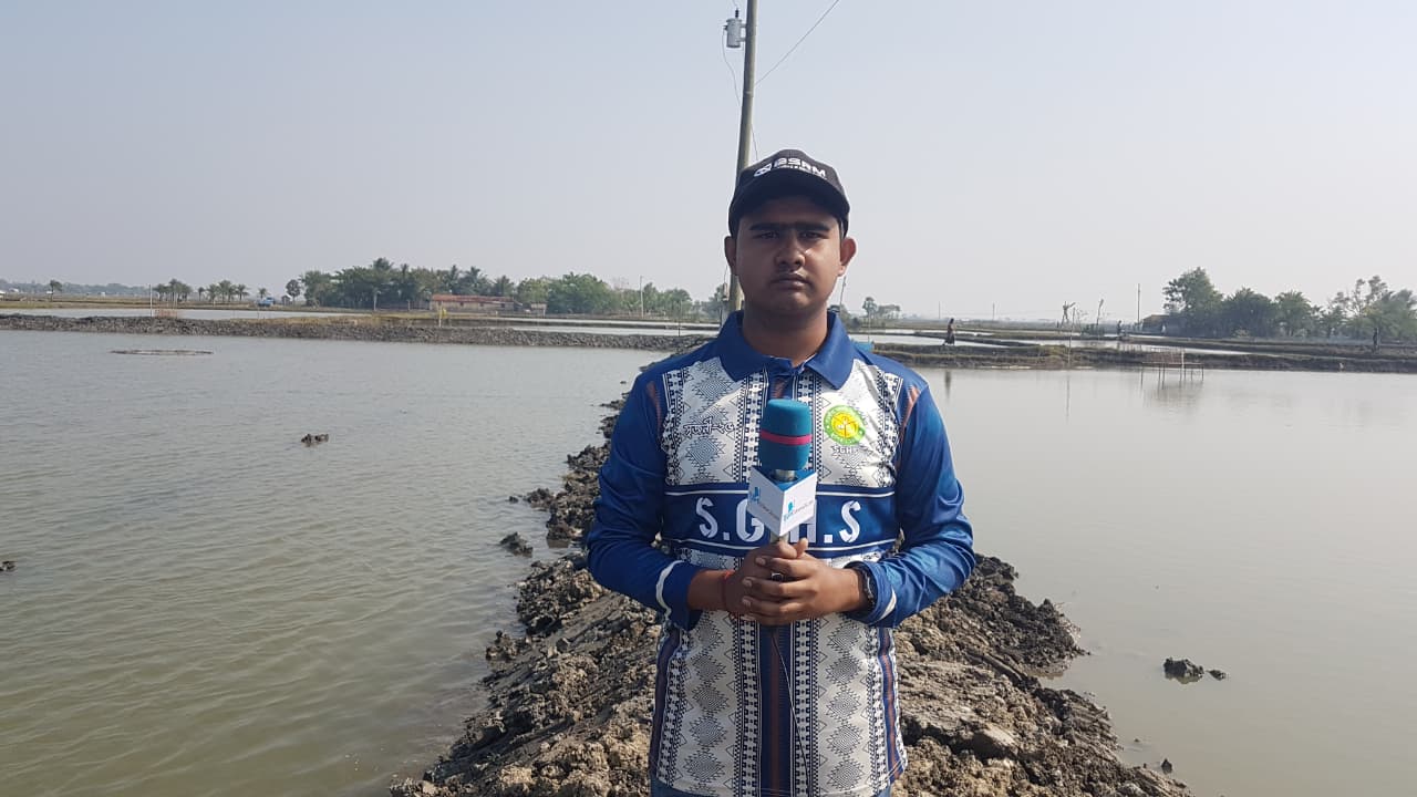 Journalist holding a microphone at an interview about child labour and social issues